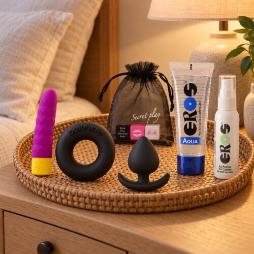 Grundkit med sexleksaker: minivibrator, penisring, analplugg och tärningar – stämningsbild (AI-genererad bild)